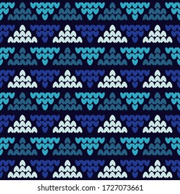 Seamless knitted pattern. Blue. Norwegian drawing. A warm sweater. Vector illustration for web design or print.