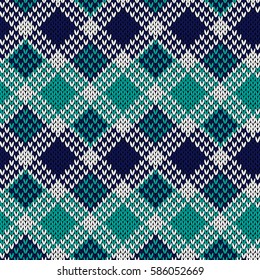 Seamless knitted pattern in blue, turquoise and white colors