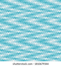Seamless knitted pattern of blue and white. Handmade knitted textile imitation. Abstract geometric background