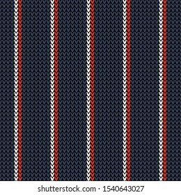 Seamless knitted pattern in dark blue, red, and white with vertical stripes. Winter holiday knit texture for winter scarf, hat, top, bag, or other modern textile design.