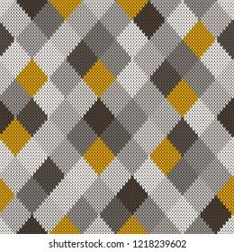 Seamless knitted pattern with gray and yellow rhombus.Vector texture