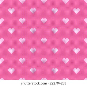 Seamless knitted pattern. Hearts on a pink background. Similar to the classic polka dot. Vector illustration. 