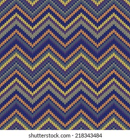 Seamless knitted pattern. Multicolored repeating tribal template