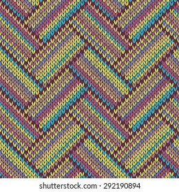 Seamless knitted pattern. Multicolored repeating tribal template