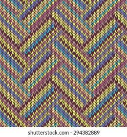 Seamless knitted pattern. Multicolored repeating tribal template