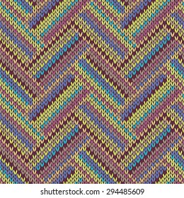 Seamless knitted pattern. Multicolored repeating tribal template