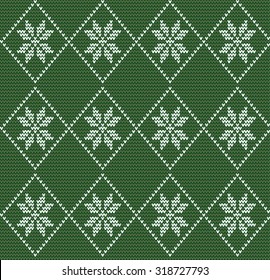 Seamless knitted pattern in nordic style with white snowflakes on green background