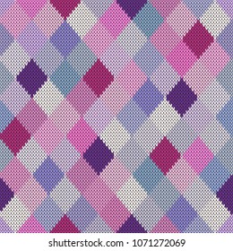 Seamless knitted pattern of pink and lilac rhombuses.Vector texture