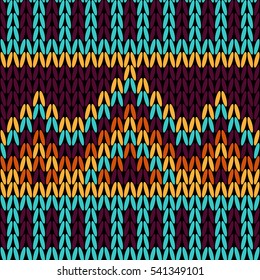 Seamless knitted pattern in warm and bright colors. Ethnic style.