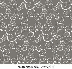 Seamless lace pattern. Vintage, curled texture. Spiral, twirl silhouettes with laurel leaves. Floral theme. Twist ornament. Light gray figure on dark gray background. Vector 