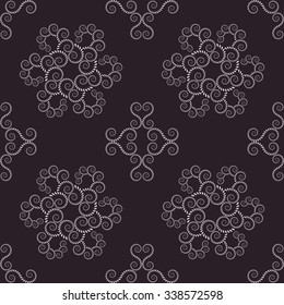 Seamless lace pattern. Vintage, curled texture. Spiral, swirl silhouettes floral snowflakes. Twist ornament of laurel leaves. Light gray figure on dark gray, black background. Silver colored. Vector