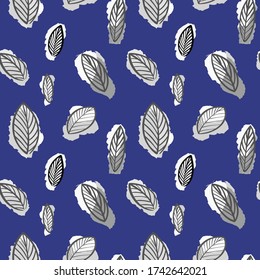 seamless leaf pattern on a blue background.hand drawn  Botanical illustration of leaves.