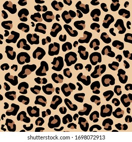 Seamless leopard pattern on beige background. Vector illustration. 