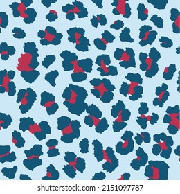 Seamless leopard pattern print in light blue, navy blue and dark red. 