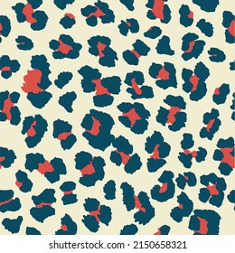 Seamless leopard pattern print in off-white cream, navy blue and berry red.