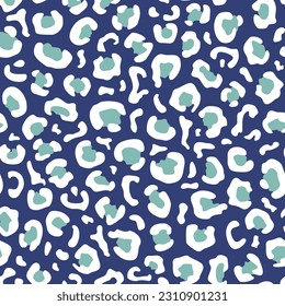 Seamless leopard print in white and green colors on a dark blue background. Flat vector illustration