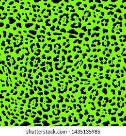 Seamless leopard/jaguar print with black spots on neon green background. Vector illustration animal print repeat surface pattern. Punk rock eighties/80s fashion style textile pattern.