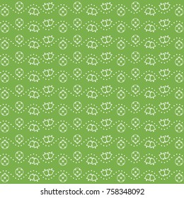 Seamless light green pattern of christmas ornament and bells with wavy dotted lines