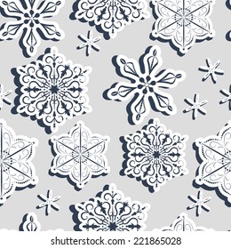 Seamless light grey pattern with three-dimensional paper snowflakes with shadow