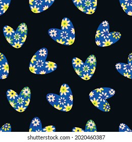Seamless love heart vector seamless pattern in boho style. Retro blue yellow white hearts on black backdrop. Simple folk art floral hearts repeat. All over print for cottage decor, packaging