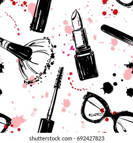 Seamless makeup cosmetics pattern. Vector hand drawn graphic fashion illustration: glasses, makeup brush, lipstick, Brush of Mascara, mascara. Seamless pattern With pink and black ink sprays.