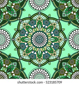 Seamless mandala medallion pattern in shades of green, yellow & white. 