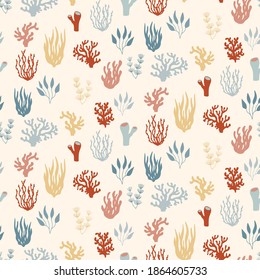 Seamless marine pattern of underwater plants and coral reefs. Red and blue nautical background with seaweeds in hand drawn sketch style