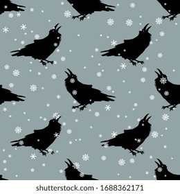 
Seamless monochrome animal winter pattern with silhouettes of ravens and snowflakes.