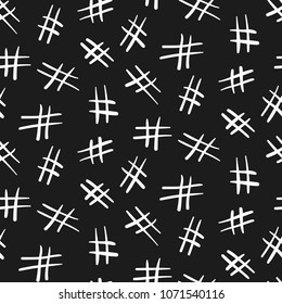 Seamless monochrome pattern with chaotic white doodle hashtag symbols on black background. Trendy social media sign texture for textile, wrapping paper, cover, surface