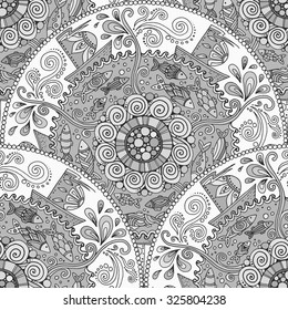 Seamless monochrome pattern. Ethnic mandala background with decorative ornament, doodle fishes, waves, wind and ships.