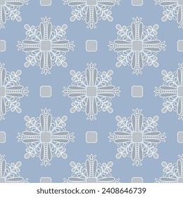 Seamless monochrome pattern with geometrical mandalas. Folk style. White silhouettes on light blue background.