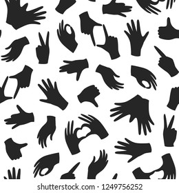 Seamless monochrome pattern with hand gesture. Human hand, palm black silhouette. Vector repeating design for fabric, wallpaper or wrap paper.
