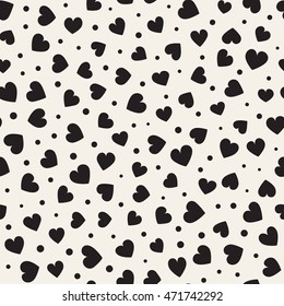 Seamless monochrome pattern with hearts and dots. Vector repeating texture.