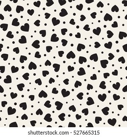 Seamless monochrome pattern with hearts and dots. Vector repeating texture. Perfect for printing on fabric or paper.