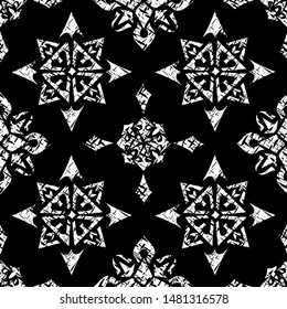 Seamless monochrome pattern. On a black background white contours of geometric shapes. Vector illustration.