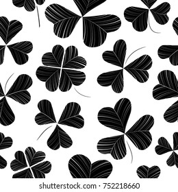 Seamless monochrome pattern with various clover leaves