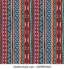 Seamless multicolored ethnic pattern with geometric, floral, decorative and fashion elements. For wallpaper, textiles, souvenirs, printing and prints.
