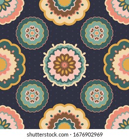 Seamless multicoloured pattern of large retro flowers on a dark blue background. 