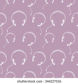 Seamless music vector pattern, chaotic background with headphones, over pink backdrop