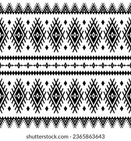 Seamless native pattern in black and white color. Oriental ethnic motif design for textile. Abstract background with tribal motive.
