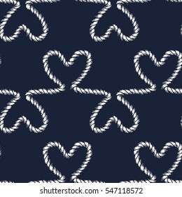 Seamless nautical romantic rope pattern. Endless ornament with white hearts on dark blue backdrop. Valentines day or wedding maritime style background. For fabric, wrapping, packaging paper