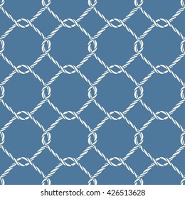 Seamless nautical rope knot pattern. Endless navy illustration with white fishing net ornament and twisted cord on blue backdrop. Trendy maritime style background. For fabric, wallpaper, wrapping.