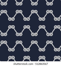 Seamless nautical rope pattern. Endless navy illustration with white loop ornament. Marine figure eight knots on dark blue backdrop. Trendy maritime style background. For fabric, wallpaper, wrapping