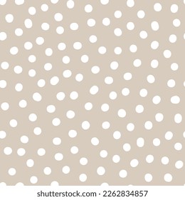 Seamless neutral polka dots pattern. White hand-drawn circles isolated on beige background. Abstract Random points ornament. Vector illustration for wallpaper, fabric, print, wrapping paper, textile