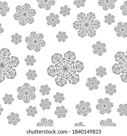 Año Nuevo y patrón de Navidad sin inconvenientes. Copos de nieve de mandala negra sobre un fondo blanco. Impresión en papel de embalaje. Fondo acuático de invierno dibujado a mano. Nieve e impresión de ventisca.