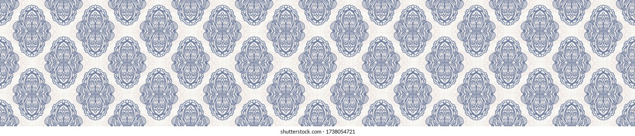 Seamless ogee border pattern in french blue linen shabby chic style. Hand drawn floral damask texture. Old white blue background. Interior home decor edge bordure. Ornate flourish motif ribbon trim.
