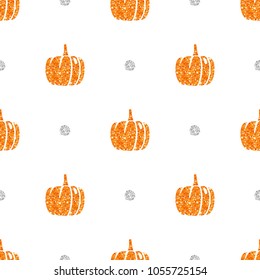 seamless oragne glitter pumpkin with silver dot glitter pattern on white background