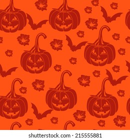 Seamless orange background with pumpkins for Halloween.
