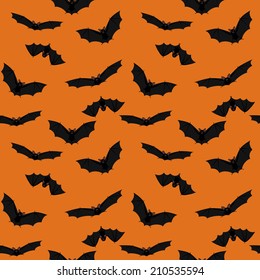 Seamless orange halloween background with flying bats