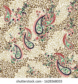 seamless orange paisley pattern on brown leopard background